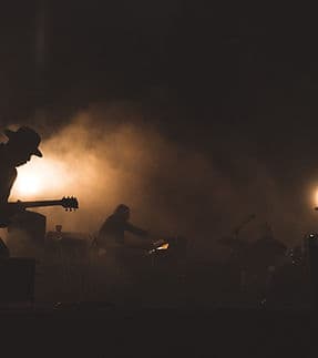 Band performing live on stage — MerchMaster band merch app helps artists sell more merchandise at every show